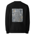 Long Before Easy sweater, black — back view of worn metal slogan plate with robin, reading "Mastery is not the day the work felt easy. It is the year the work was done long before easy arrived." — Ricki Robin