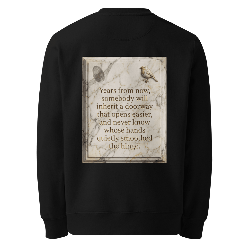 Quietly Smoothed sweater, black — back view of marble slogan plate with fingerprint and robin, reading "Years from now, somebody will inherit a doorway that opens easier, and never know whose hands quietly smoothed the hinge." — Ricki Robin