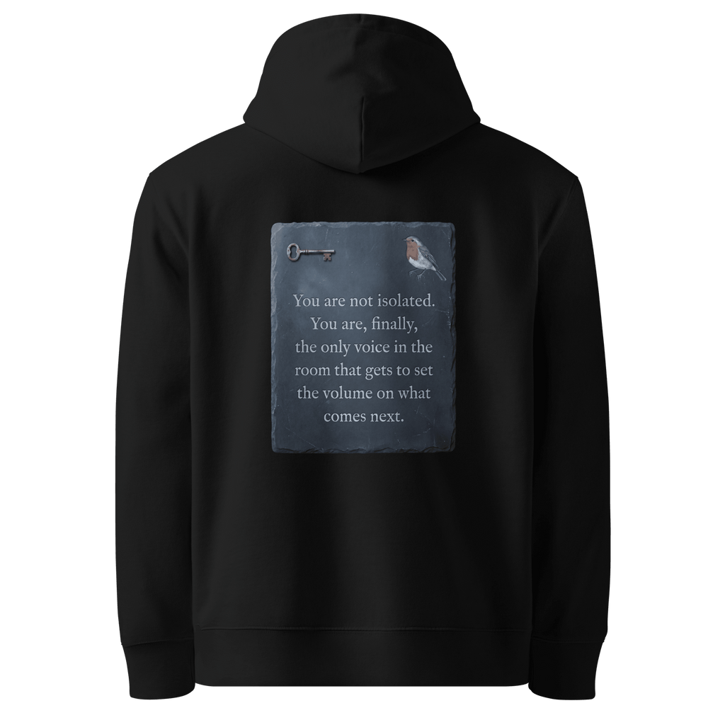 Set The Volume hoodie, black — back view of slate slogan plate with key and robin, reading "You are not isolated. You are, finally, the only voice in the room that gets to set the volume on what comes next." — Ricki Robin