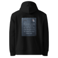 Set The Volume hoodie, black — back view of slate slogan plate with key and robin, reading "You are not isolated. You are, finally, the only voice in the room that gets to set the volume on what comes next." — Ricki Robin