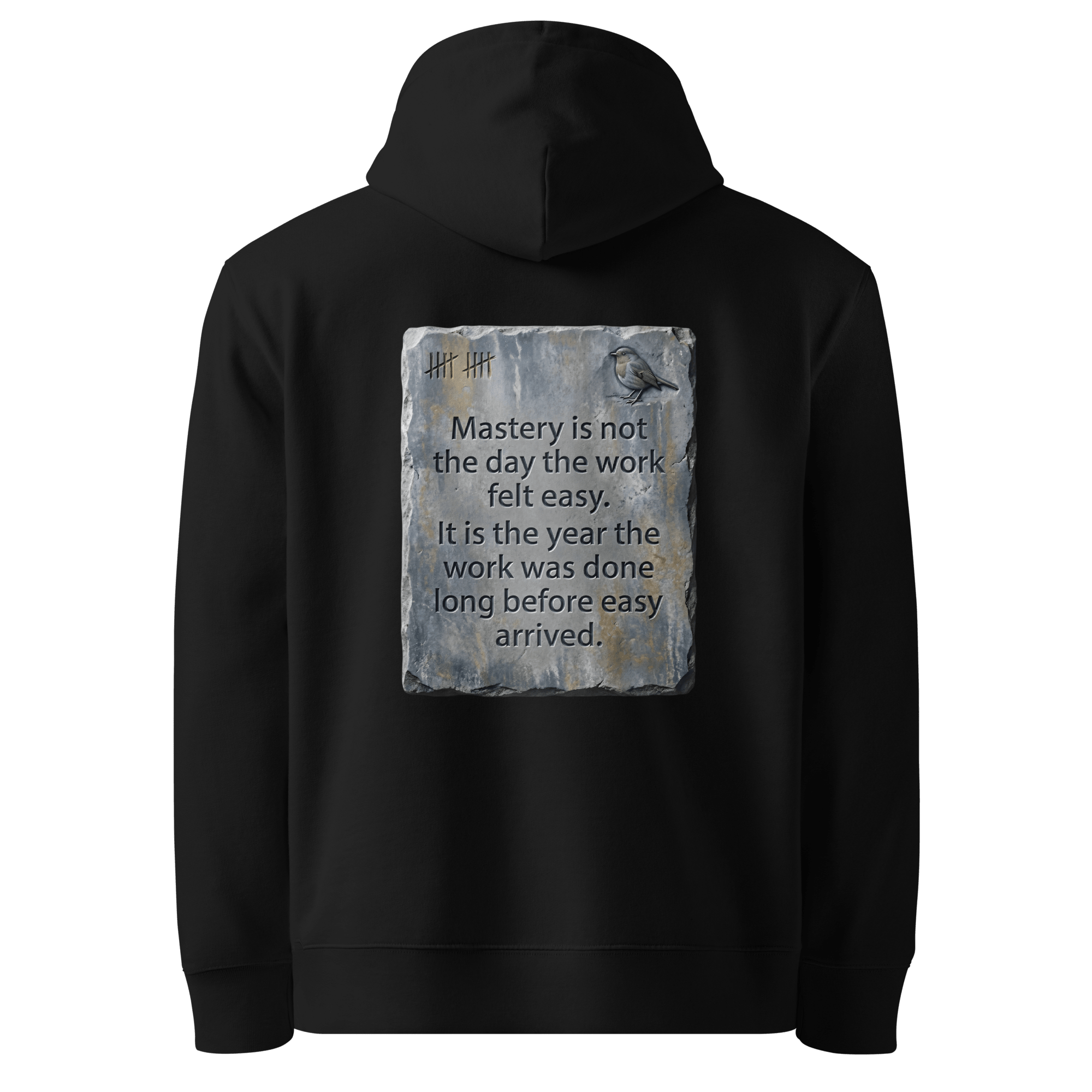 Long Before Easy hoodie, black — back view of worn metal slogan plate with robin, reading "Mastery is not the day the work felt easy. It is the year the work was done long before easy arrived." — Ricki Robin