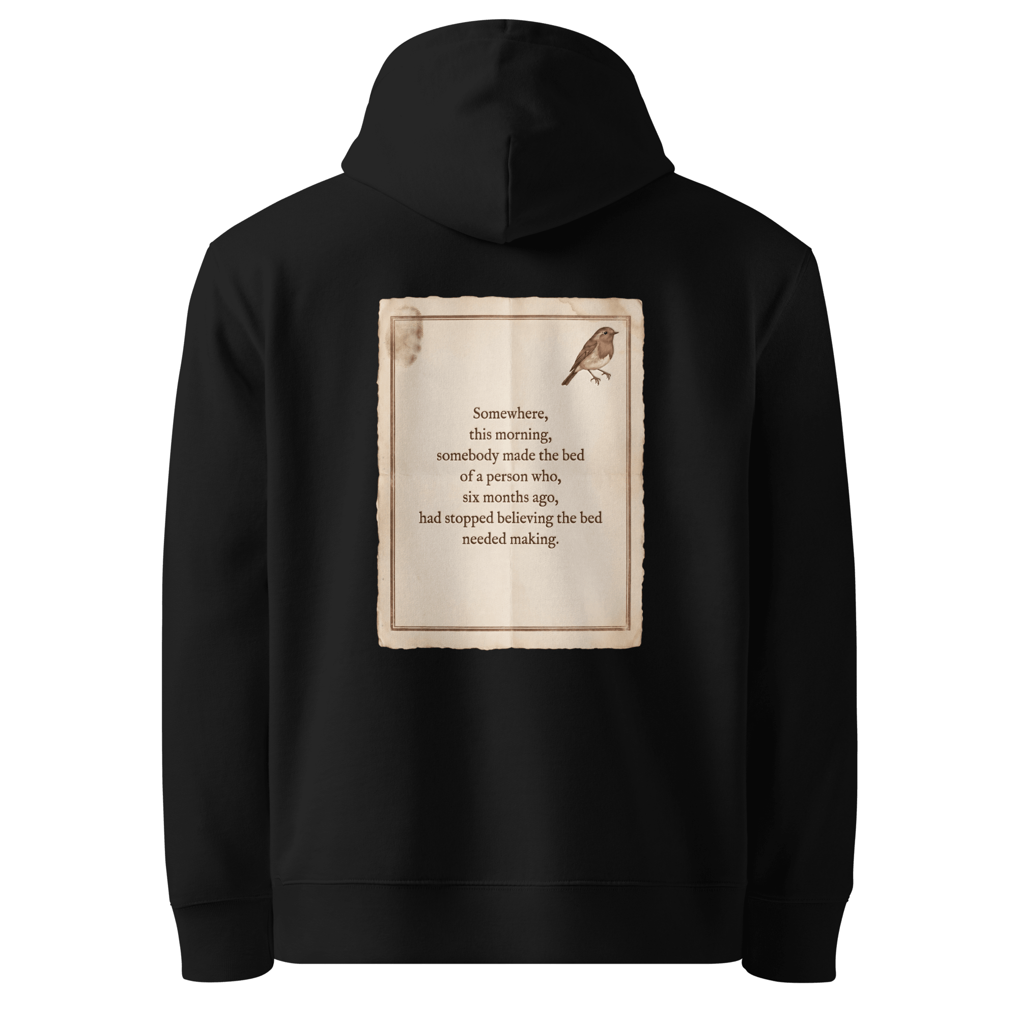 Made The Bed hoodie, black — back view of aged paper slogan plate with robin, reading "Somewhere, this morning, somebody made the bed of a person who, six months ago, had stopped believing the bed needed making." — Ricki Robin
