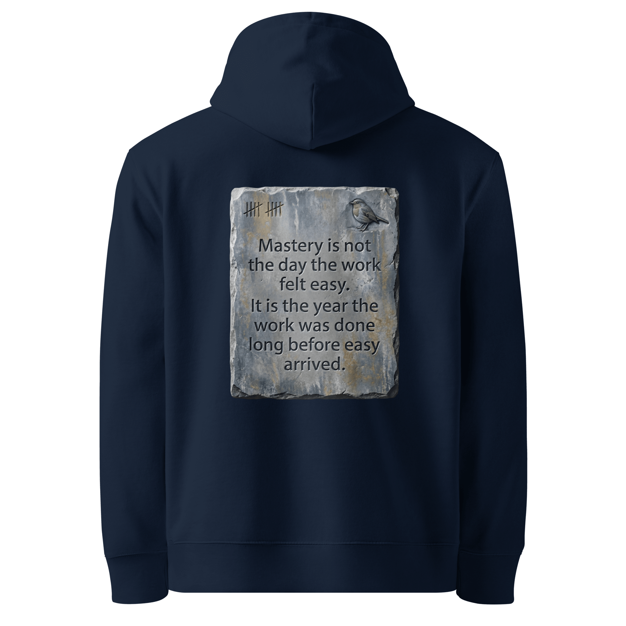 
Long Before Easy hoodie, French Navy — back view of worn metal slogan plate with robin, reading "Mastery is not the day the work felt easy. It is the year the work was done long before easy arrived." — Ricki Robin